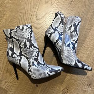 Size 9 snake print booties. Never worn.
